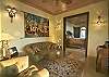 The master bedroom is seperated into three sections; the sitting room...