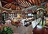 The Great Room is graced with high arched windows and artistic stonework crafted in the classic St. John style.