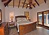 The  comfortable elegant upper bedroom suite is identical in size to the poolside suite below.