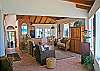To the East side of the great room are the sleek, contemporary kitchen and dining areas.