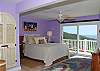 The matching bedroom on the lower level has a shade in place of curtains, for lazy mornings at home.