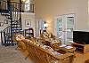 An ornate spiral staircase connects the main level to the upper sleeping level and the lower laundry level too with another full bath.
