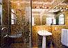 The large bathrooms all feature marbled tile work.