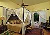 The Serengeti Room has two king size beds and sleeps four. As with all the bedrooms, this lower left master bedroom has its own private tiled bath, air conditioning, and a color TV and VCR.