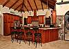 The main pavilion has a gourmet kitchen with breakfast bar with Brazilian granite countertops and is equipped with stemware and tools bereft to a skillful artisan.