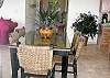 The glass top makes cleaning a breeze and the sophisticated rattan seating is perfect for tropical dining.