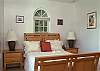 The third bedroom is beautifully decorated with its whimsical sleigh bed and attractive artwork.