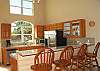 The two level countertop does double duty providing extra counter space for the chef while also acting as a breakfast bar with seating for four.