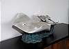 Guests will enjoy the beauty of an original silver sculpture by D'Argenta of sting rays perched on the side dining buffet. Formal china is provided for our guests for that special gourmet meal at home.