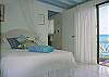 This lower level bedroom shares the same wonderful view.