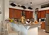 The deluxe Italian gourmet kitchen on the main level has granite countertops.  This kitchen is a chef's dream come true-with all the amenities one could imagine...even an espresso maker, bread machine and wine cooler.