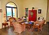 Slate floors, arched windows and doors, and air conditioning can be found throughout. The great room includes a 17-foot vaulted ceiling, comfortable seating, an entertainment center, and...