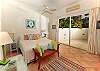 The third bedroom, Island Dream, reflects pure Caribbean charm with its cool feel-good colors of rose, aqua and lime. This bedroom offers a sparkling pool view and a bed that can be made up as twins or a king. Through sliding glass doors, you will enjoy the sound of the calming waterfall.