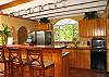 The well stocked kitchen has a convenient bar where your family and friends can sit and chat with you while you prepare their favorite meal. Or even better have one of our island chefs make you one of their local specialties!