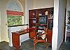 Back in the great room, a corner has been carved out to accommodate an office/entertainment center, a half bath, and an interior stairway to the main sleeping level.