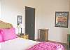 The 4th bedroom has a queen sized bed. The comforters in each bedroom aren't just for show. Occasionally the early morning hours can feel chilly at almost 900 feet above sea level.