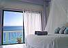 The two upper level bedrooms are accessible from an open-air patio from the great room or via the sliders opening onto the deck.