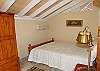 The west room boasts a queen sized bed, a split a/c unit and a drapery entrance for privacy.
