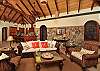 The Great Room is cooled by Fanimation Islander palm leaf ceiling fans, and has a remote controlled TV lift cabinet concealing a 46” LCD TV, iPod ready stereo and blu-ray player so as not to interfere with the stunning views of the Sir Francis Drake Channel and the BVI...