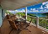 Styled for Caribbean Living, the chairs on the deck provide a perfect spot to linger and enjoy panoramic down-island views.