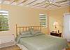 On this main level at Christy Ann, the air conditioned master bedroom has a king sized bed and a flat screen tv.