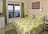 The inviting third bedroom is spacious, light and airy. This bedroom features air-conditioning, a flat screen wall mounted television, an in suite bathroom as well as a mini sink and fridge for your convenience.