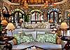 White, slipcovered, 'sink-into sofas' and chairs are grouped around the Great Room to accommodate a large party.