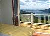 In this bedroom suite you have the option of allowing air off the harbor and hillside to breeze right through your bedroom.  Gaze out at the boats traveling through the bay or the stars above at night.