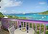 Just a few steps from the parking lot level, this unit offers a king bed and a new gourmet chef’s kitchen and has a cozy dining balcony over-looking the Cruz Bay harbor and adjacent islands.