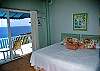 The second bedroom on the main level also has gorgeous views, an ensuite bathroom, and is accessed from either the  spa deck or the open-air garden walkway.