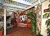 Descend the stone steps through a garden setting to the shaded entry-way of Andante By The Sea.