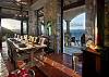 An outdoor alfresco dining area comfortably seats 10 guests for dining amidst the sea and sky.