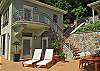 Relax on the open deck amongst a myrid or local stonework and pleasant tropical foliage.
