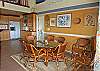 The dining room seats 8 and is adjacent to the kitchen, living room and screen gallery. Furnished with articles from the owners 50th birthday trip to Africa, In the Stars offers multiple dining and entertainment options on the main and pool level.