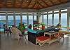 The splash of color in the living room is a perfect compliment to the serenity of the ocean.
