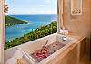 The Presidential bath is part of the whole experience of the Presidential Suite.  Only the highest end amenities were selected with your experience being  top priority.  The magnificent bath tub is tucked into the corner with a million dollar view.  To ensure that the view be unobstructed, the faucet is located in the ceiling.