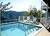 Beyond the pool, a large covered deck provides shade and also is the location for the other two bedroom suites. The pool specs are 16' x 16' x 5' deep.