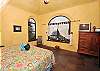 A 6-foot picture window in the spacious master bedroom adds light and offers spectacular vistas of the harbor. Double doors open to the shaded verandah and sitting area on Mayan Sky's upper level.