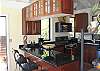 Designed for lively entertainment, the airy kitchen at Magic View has convenient counter stools for conversing with the chef.