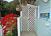Around the corner and bordered by a fantastic poinsetta hedge, there's an outdoor shower just steps away from the swimming pool.