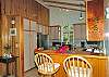 The kitchen at In Harmony was carefully designed to pack a lot of capability in a small space. You will love the convenient breakfast bar to stainless steel appliances including dishwasher, of course.