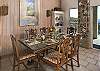Dine at the serve-across bar which connects the kitchen to the dining area or at the large formal mahogany dining table that seats six...