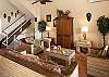 The large great room features ceramic tile floors, comfortable rattan furniture and Caribbean artwork. The entertainment center is fully stocked with TV/VCR, cable TV and a CD player.