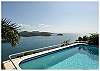 The 26 ft X 15 ft pool is the center of attention on the main deck at Heaven's Gate. The pool and sundeck are framed by tropical flowers and palms.