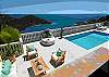 The scattered outdoor loungers and chairs are strategically placed for those who wish to engage in conversation around the coffee table or soak up some sun beside the pool.