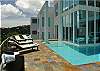 Relax in the wraparound pool or take in the sun on one of the  comfortable loungers.