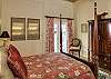 The third bedroom suite at Island Manor also features a queen four poster bed. It features colors in hues of coral, burnt oranges, lime and beige…reminiscent of the colors of our warm tropical sun.