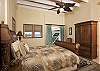 Enjoy the retreat of this quiet bedroom away from the rest of your group. This queen sized four-poster bed faces the ocean view. It, like each other bedroom suite at Island Manor is located on its own private level in the house and features its own private in suite bathroom and balcony.
