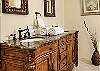 The bathrooms at Island Manor feature custom designed heavy wooden sink vanities, walk-in showers and a wonderful soothing décor. Plush towels and toiletries are provided for every guest.