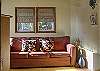 Just off the great room, is the den which features a pullout sofa for additional guests as well as an extra television.